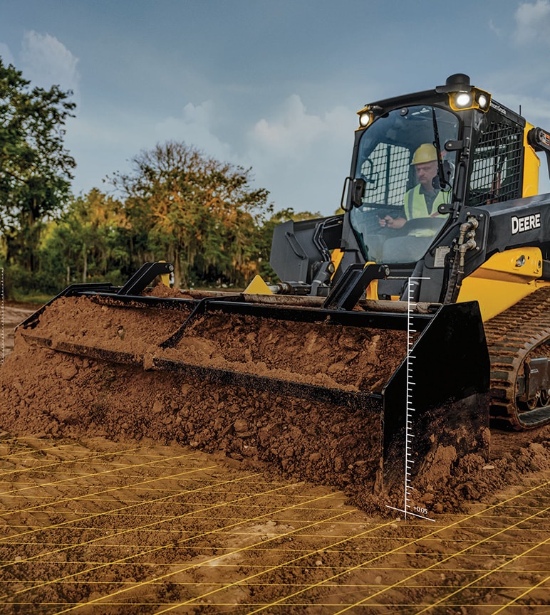 Equipos de construcción Deere que empujan la suciedad
