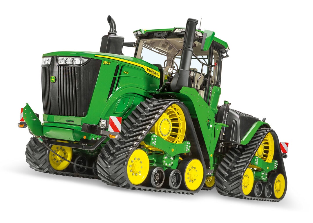 Tractor John Deere 9RX 640 con orugas, alta potencia y tecnología de agricultura de precisión.